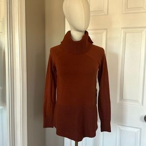 Cyrus rust cowl turtleneck sweater.